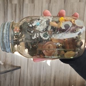 Old ball jar with atlus zinc lid of oddities and buttons